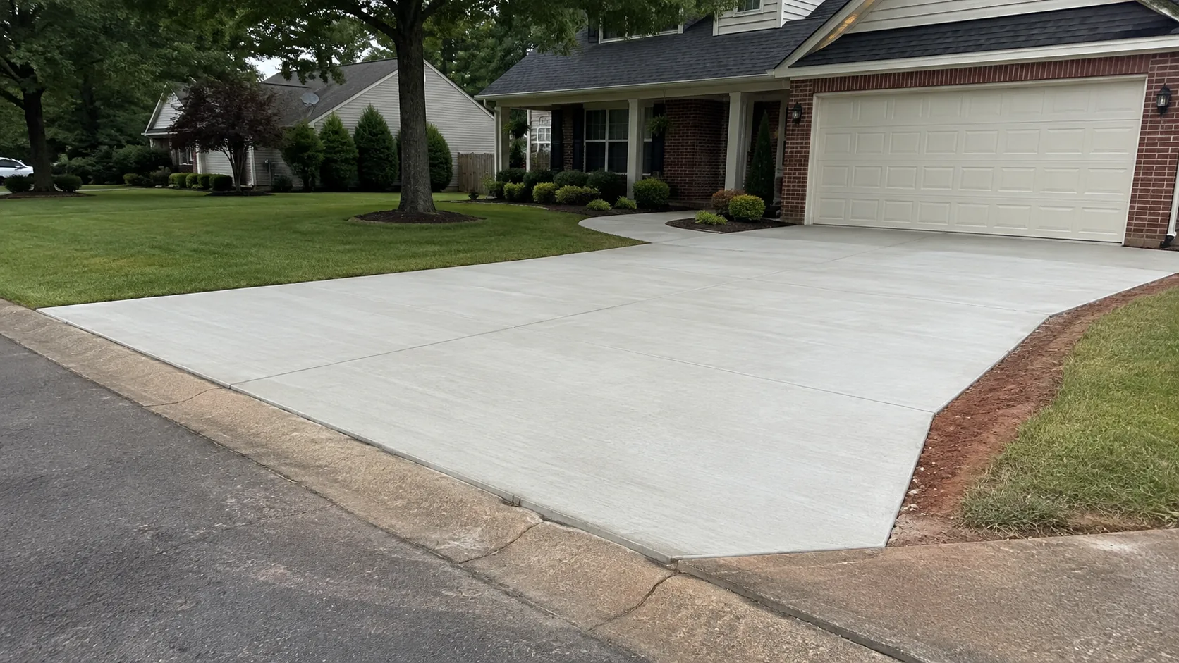 Finished concrete driveway and connecting front walk at a north Georgia home