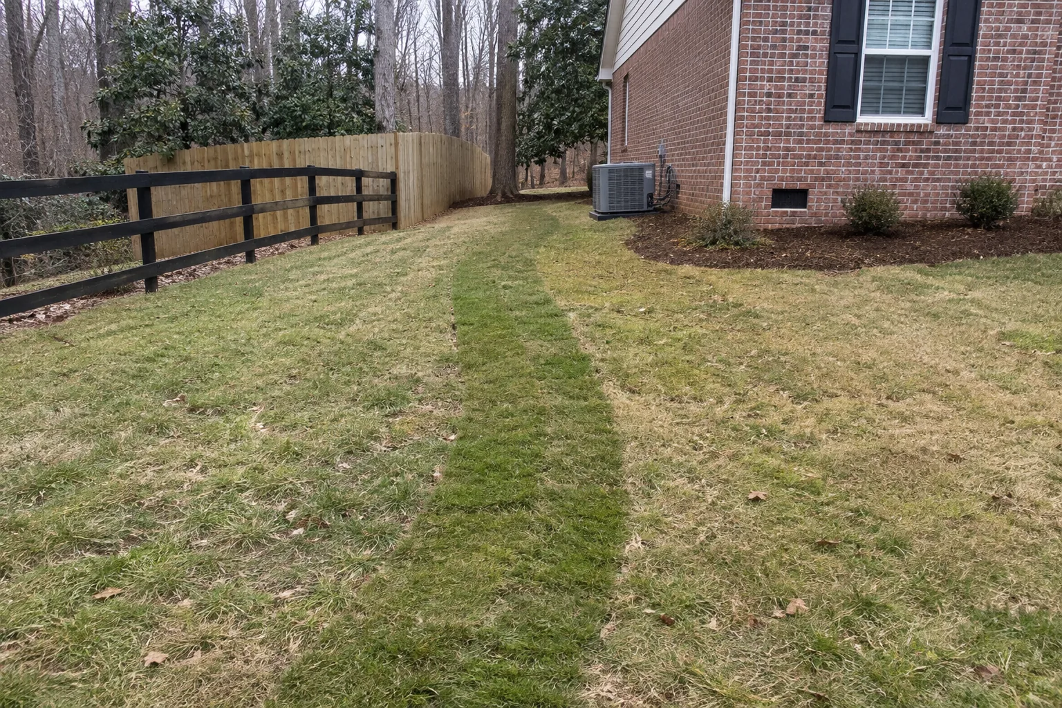Backfilled trench route restored with a narrow sod strip